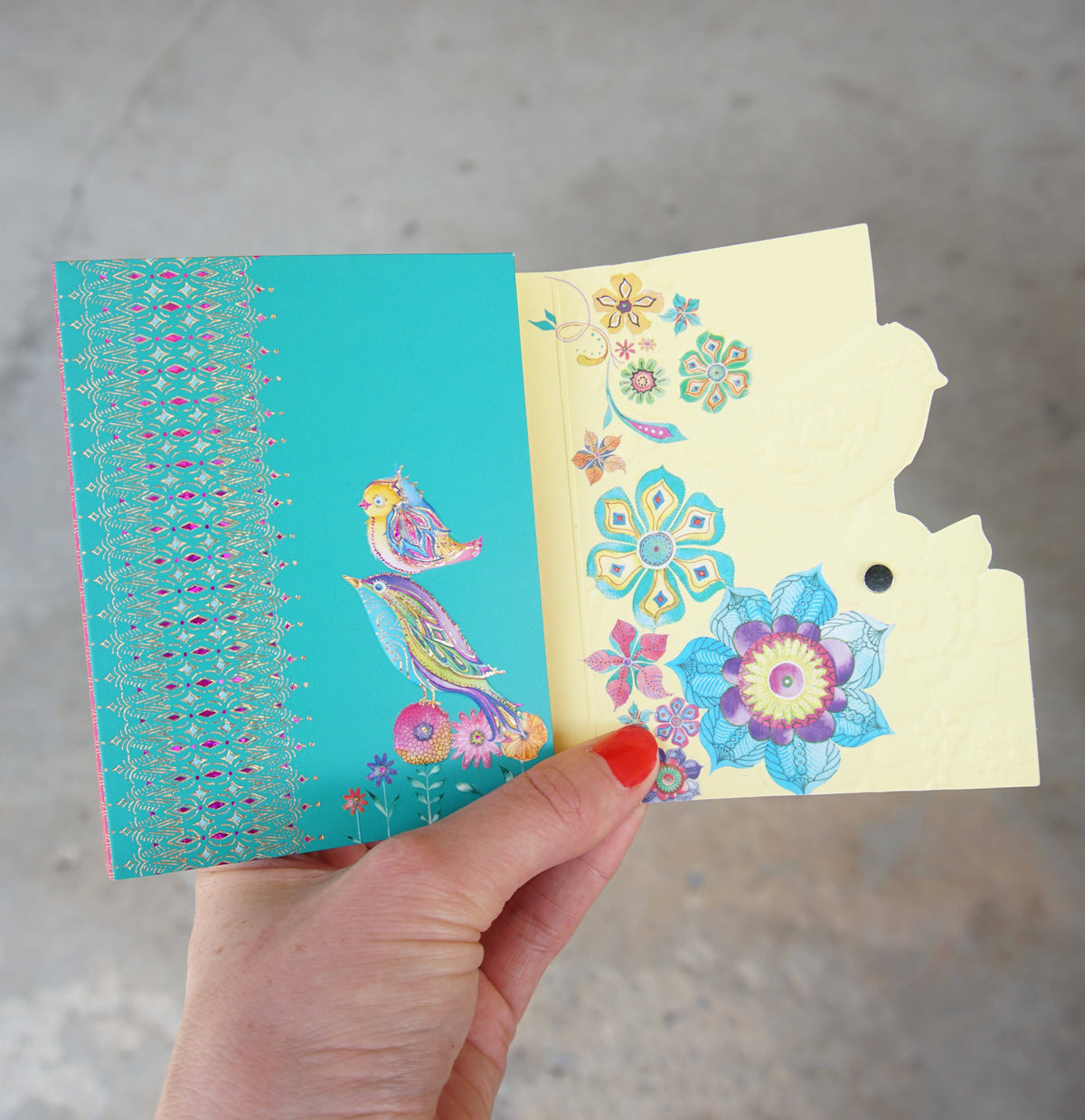 Pictura purse pad with a bird perch design, featuring soft padding and a small bird-shaped perch for stylish accessory protection.