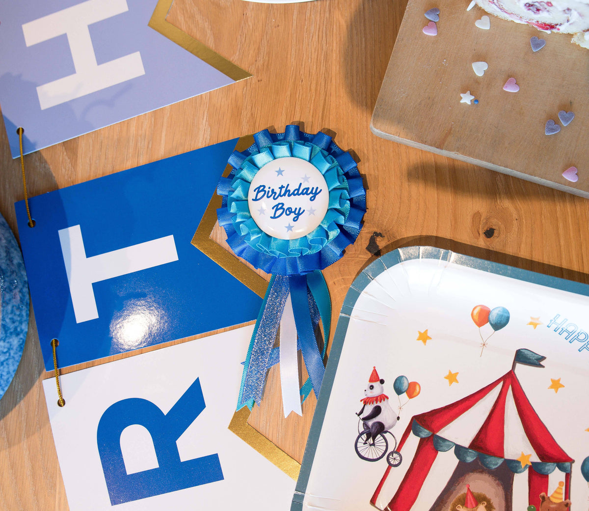 Blue birthday boy badge with paper glasses and wand, perfect for party accessories by Party Partners.