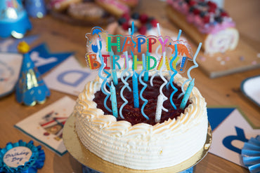 Blue glitter candle set by Party Partners featuring 24 decorative candles for celebrations and special occasions.