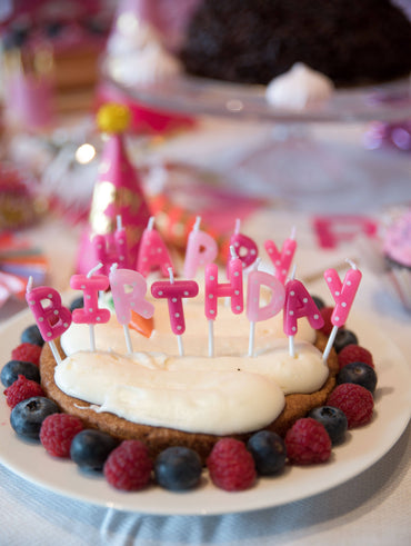 Pink dotted birthday candle set from Party Partners featuring cheerful candles for celebration.