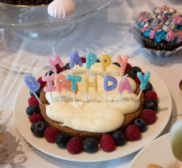 Set of pastel dotted birthday candles from Party Partners, arranged for celebration on a clean background.