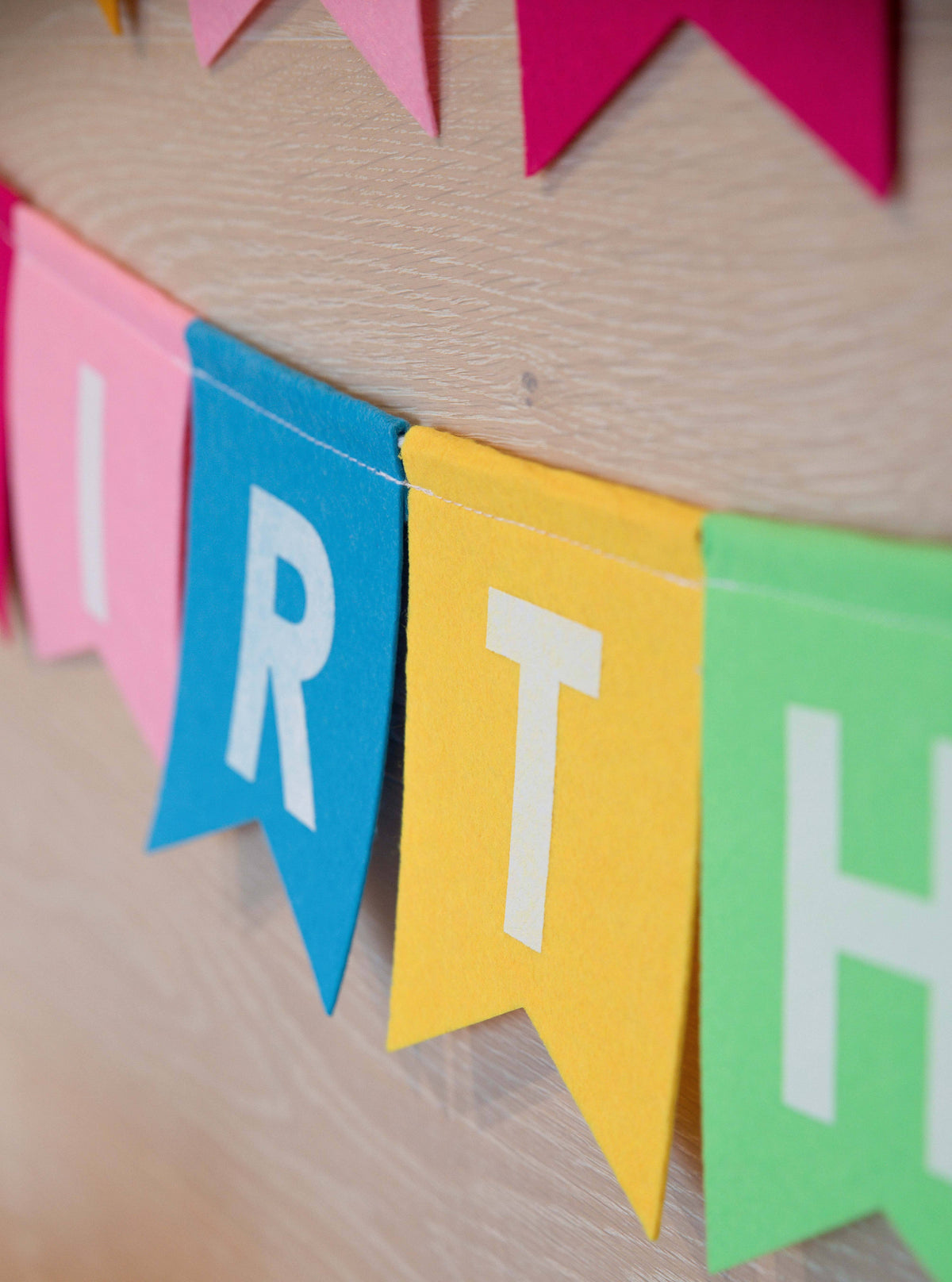 Felt birthday banner by Cardmore with colorful "Happy Birthday" pendant garland for celebration decorations.