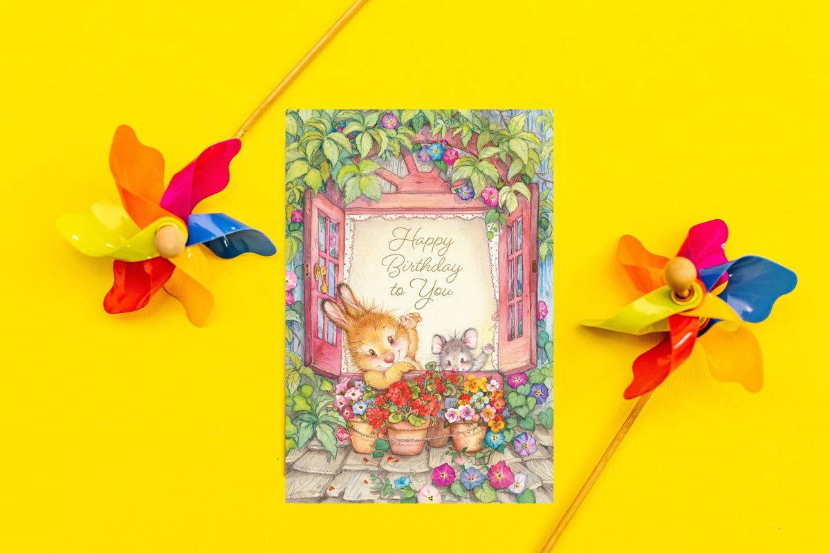 Waving Window Birthday Card by Lisi Martin for Pictura featuring a cheerful design with a waving figure and festive elements.