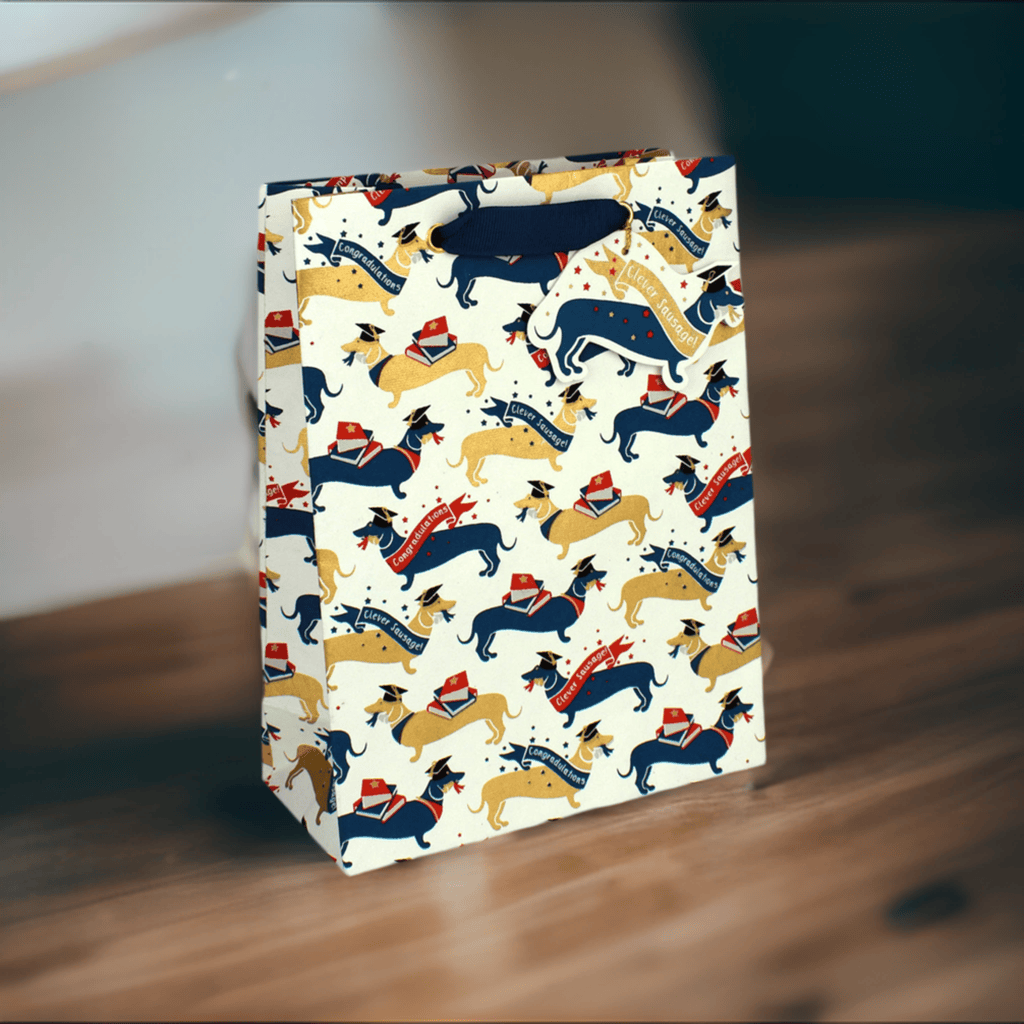 Love Vivid Clever Sausage Med Bag gift bag with playful sausage print and vibrant colors, ideal for gift packaging.