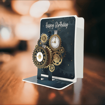 Pictura small pop-up clock card with intricate paper design, showcasing a detailed clock face on a foldable greeting card.
