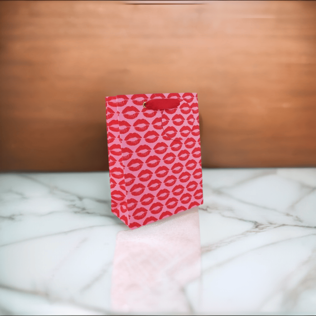 Love Vivid Kisses Med Gift Bag with colorful kiss print for gift presentation and packaging.