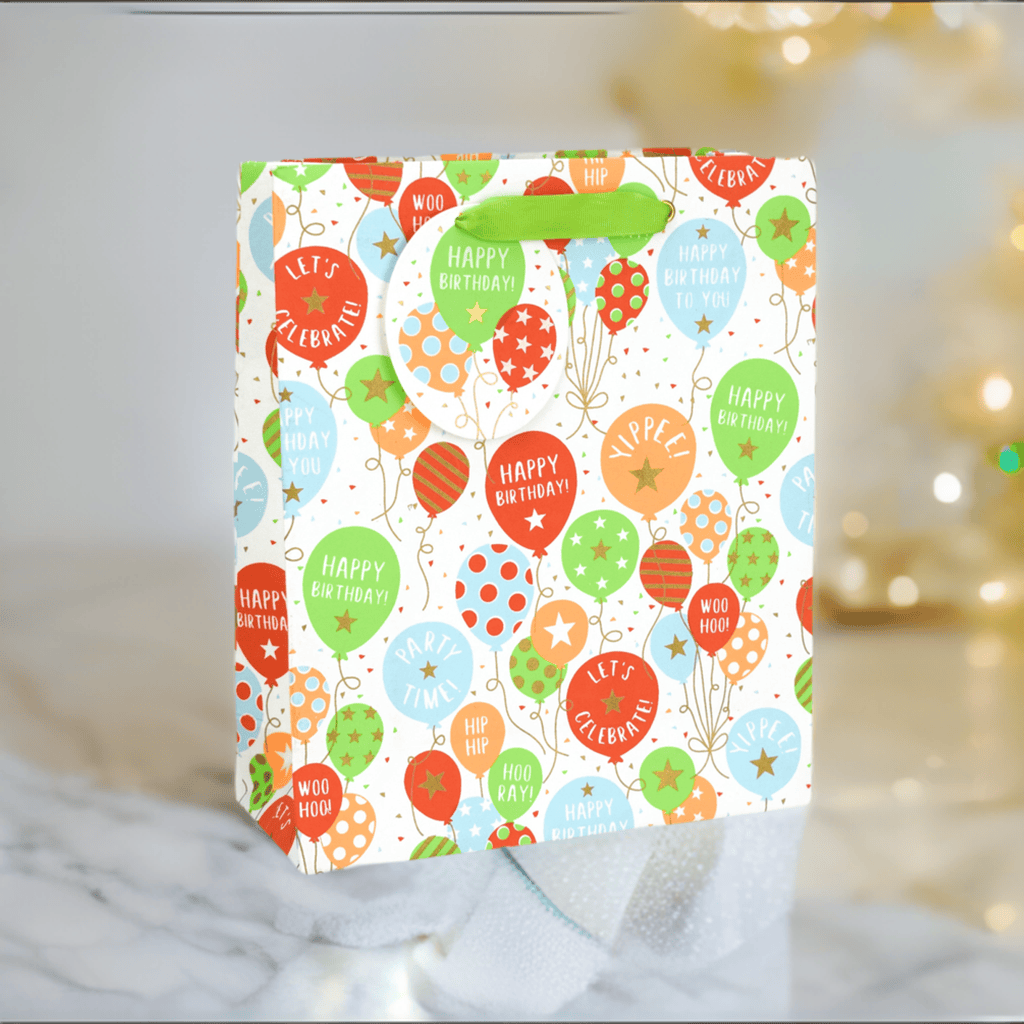 Large gift bag with colorful balloon design from Love Vivid, perfect for party favors or special occasions.