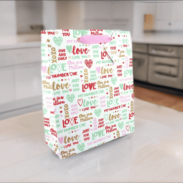 Large Love Vivid gift bag from the Just for You collection with colorful floral and heart patterns.