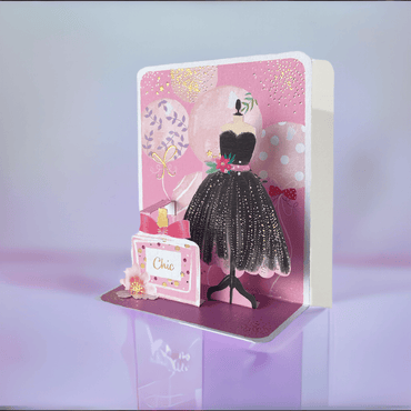 Black dress pop-up card from Pictura featuring a chic, detailed paper design of a small elegant dress on a white background