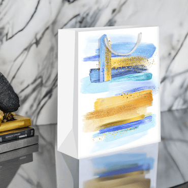 Blue and gold medium gift bags by Pictura, featuring elegant designs perfect for special occasions.