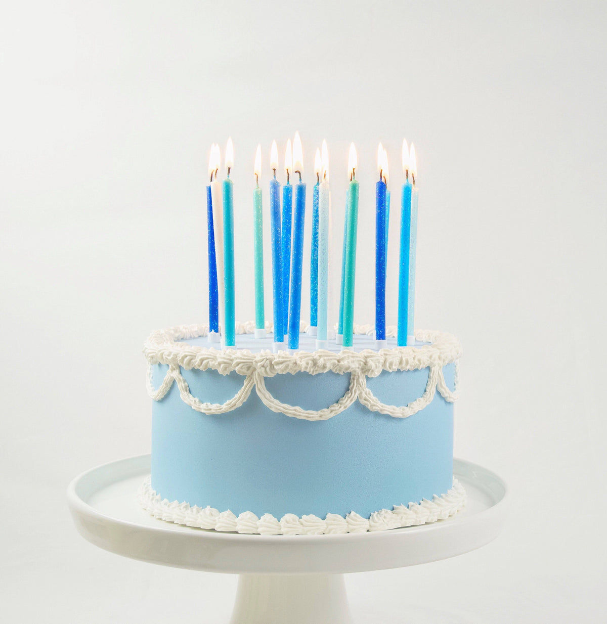 Tall blue gradient candles from Party Partners Candle Set, featuring elegant blue-hued candles with a smooth gradient finish.