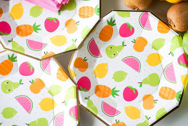 Party Partners tropical fruit plates with colorful fruit designs, perfect for serving snacks at summer gatherings.
