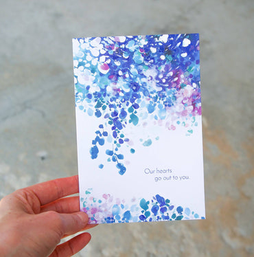 Painted blue sympathy card from Pictura, featuring heartfelt floral artwork, designed for expressing condolences and support.