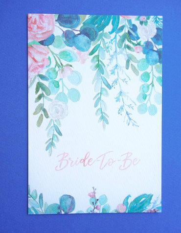 Watercolor greenery wedding shower invitation card by Pictura featuring elegant green floral design on white background.