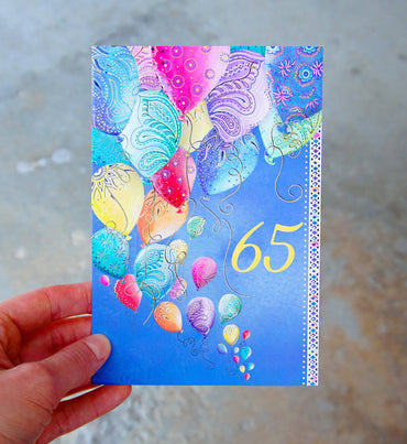 Pictura 65th Balloons birthday card with colorful balloon illustrations on a festive greeting card for milestone celebrations.