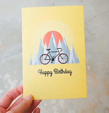 Pictura mountain biking birthday card featuring a scenic outdoor trail with cyclists, suitable for outdoor adventure and biking enthusiasts.