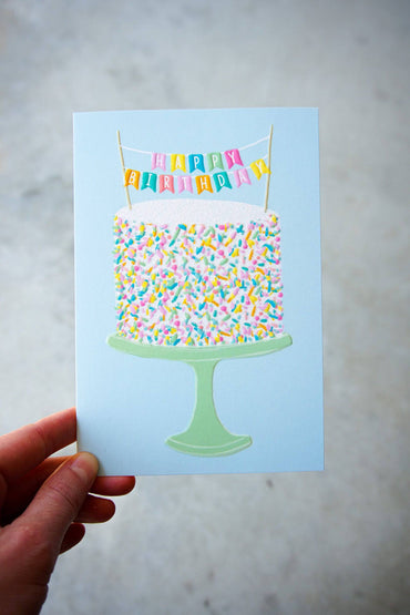 Pictura Sprinkle Cake birthday card with colorful cake illustration and festive design, suitable for celebrating birthdays.