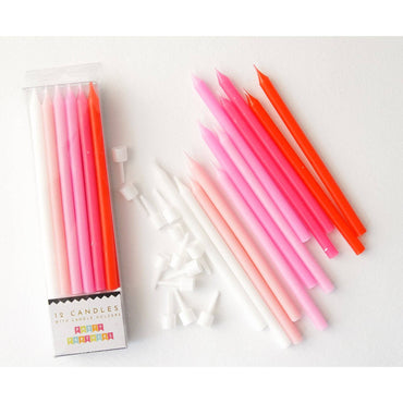 Pink gradient candle set from Party Partners, featuring elegant tapered candles arranged in a decorative display.