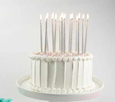Set of tall silver glitter candles from Party Partners, featuring a sleek solid silver design perfect for elegant decor.