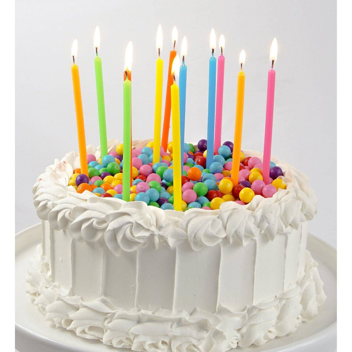 Colorful neon rainbow candles from Party Partners Candle Set, showcasing vibrant, decorative candles on a white background.