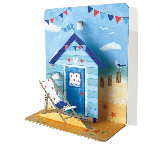 Pictura small pop-up card featuring a detailed house on the beach scene with colorful seaside elements.