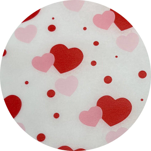 Red and pink heart tissue paper from Party Partners, featuring a festive pattern perfect for gift wrapping or decorations.